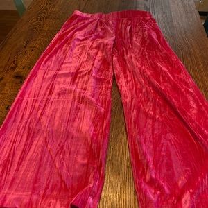 Hot pink crush wide leg pants with elastic waist and pockets.
